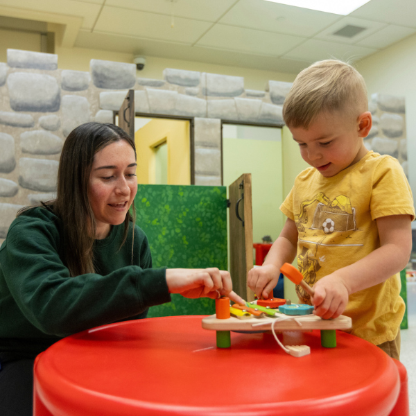 Gabby Young working with a child participant in the SEND lab.